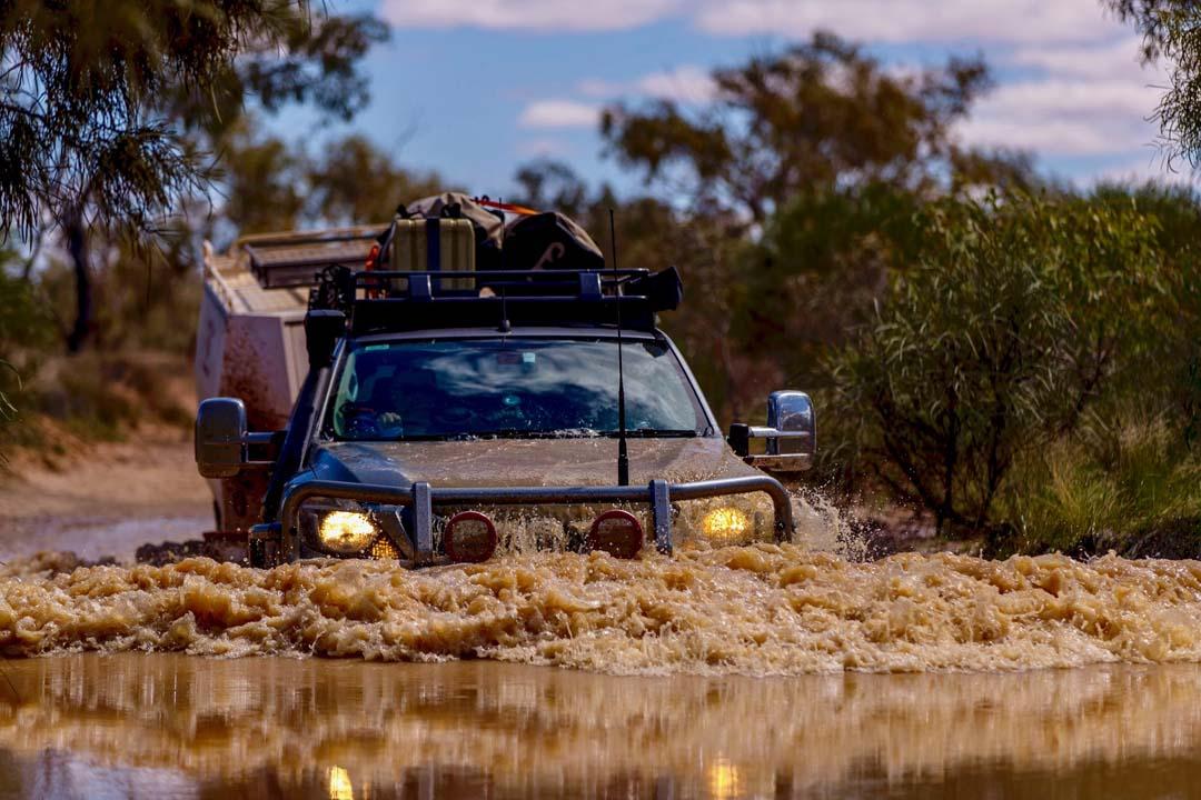 4x4 driving through a water crossing