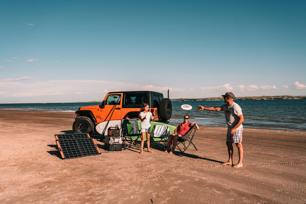 Jackery portable power station at a beach campsite