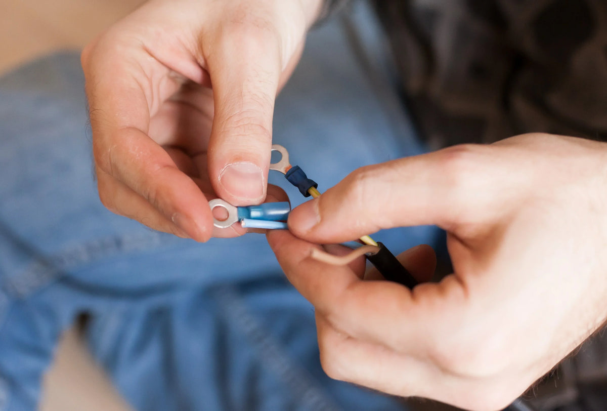 Close-up of a wire connection being made